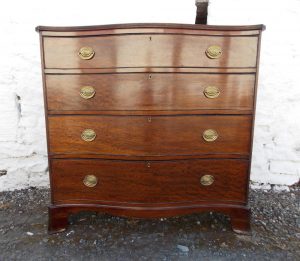 Georgian serpentine mahogany plum pudding chest of drawers.