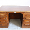 Early 20th Century oak pedestal partners desk, by Thomas Turner,