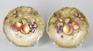 A pair of Royal Worcester porcelain fruit-painted plates.