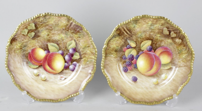 A pair of Royal Worcester porcelain fruit-painted plates.