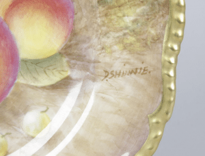 A pair of Royal Worcester porcelain fruit-painted plates.