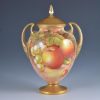 A Royal Worcester vase and cover, shape 2701/2, painted with fruit by John Cook, signed, 17cm.