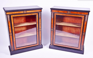 A pair of Victorian ebonised and ormolu mounted burr walnut pier cabinets
