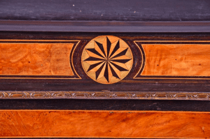 A pair of Victorian ebonised and ormolu mounted burr walnut pier cabinets