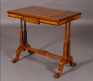 Regency period walnut and specimen woods rectangular stretcher table.