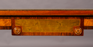 A Regency period walnut and specimen woods rectangular stretcher table.