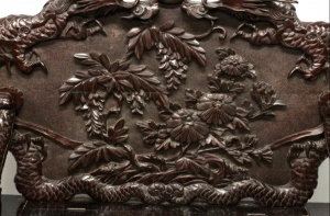 A JAPANESE MEIJI PERIOD CARVED HARDWOOD SETTLE