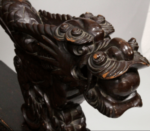 A JAPANESE MEIJI PERIOD CARVED HARDWOOD SETTLE