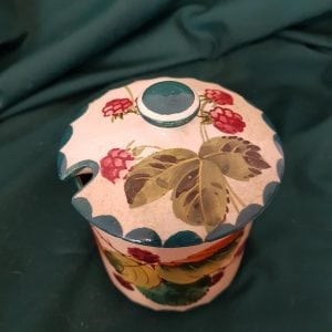 Wemyss ware jam pot decorated with rasberries