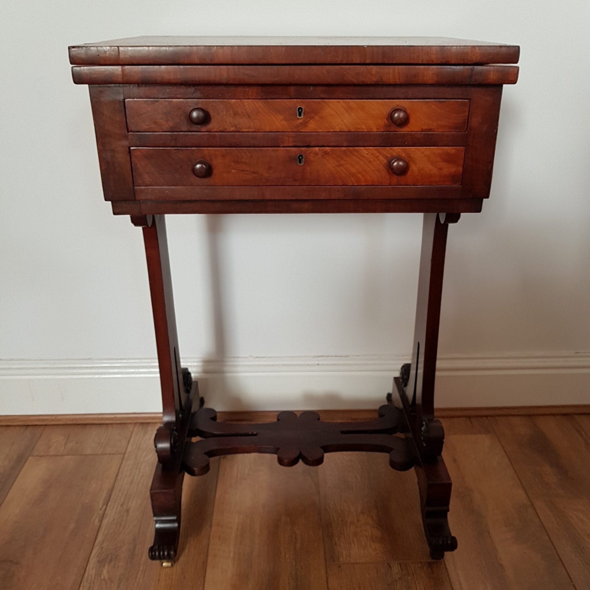 Early Victorian mahogany fold over card table