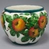 A rare Wemyss ware pottery jardiniere, decorated with Apples in good original condition. Imprest mark "Wemyss" Plus T Goode & co. Black stamp Size; height 17cm