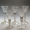 Five finely engraved airtwist wine glasses mid 18th century,