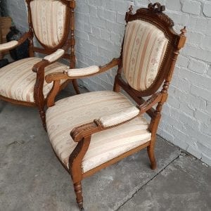 Pair French 19th century carved open arm chairs.