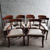 A superb set of 10 Regency period mahogany sabre leg chairs Incl; Two carvers