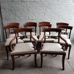 A superb set of 10 Regency period mahogany sabre leg chairs Incl; Two carvers