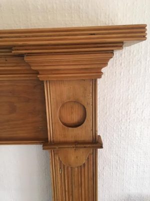 A Victorian pine fire surround