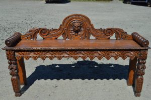 A Victorian carved oak Bench