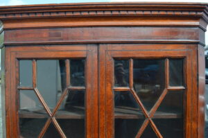 Georgian oak corner cabinet on base