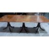 A 19th century three pedestal mahogany dining table with two leaves