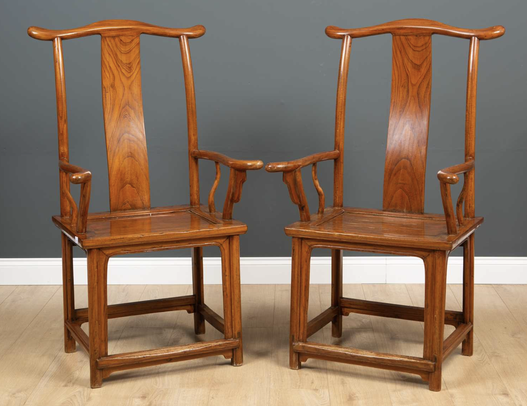 A pair of Chinese elm open armchairs