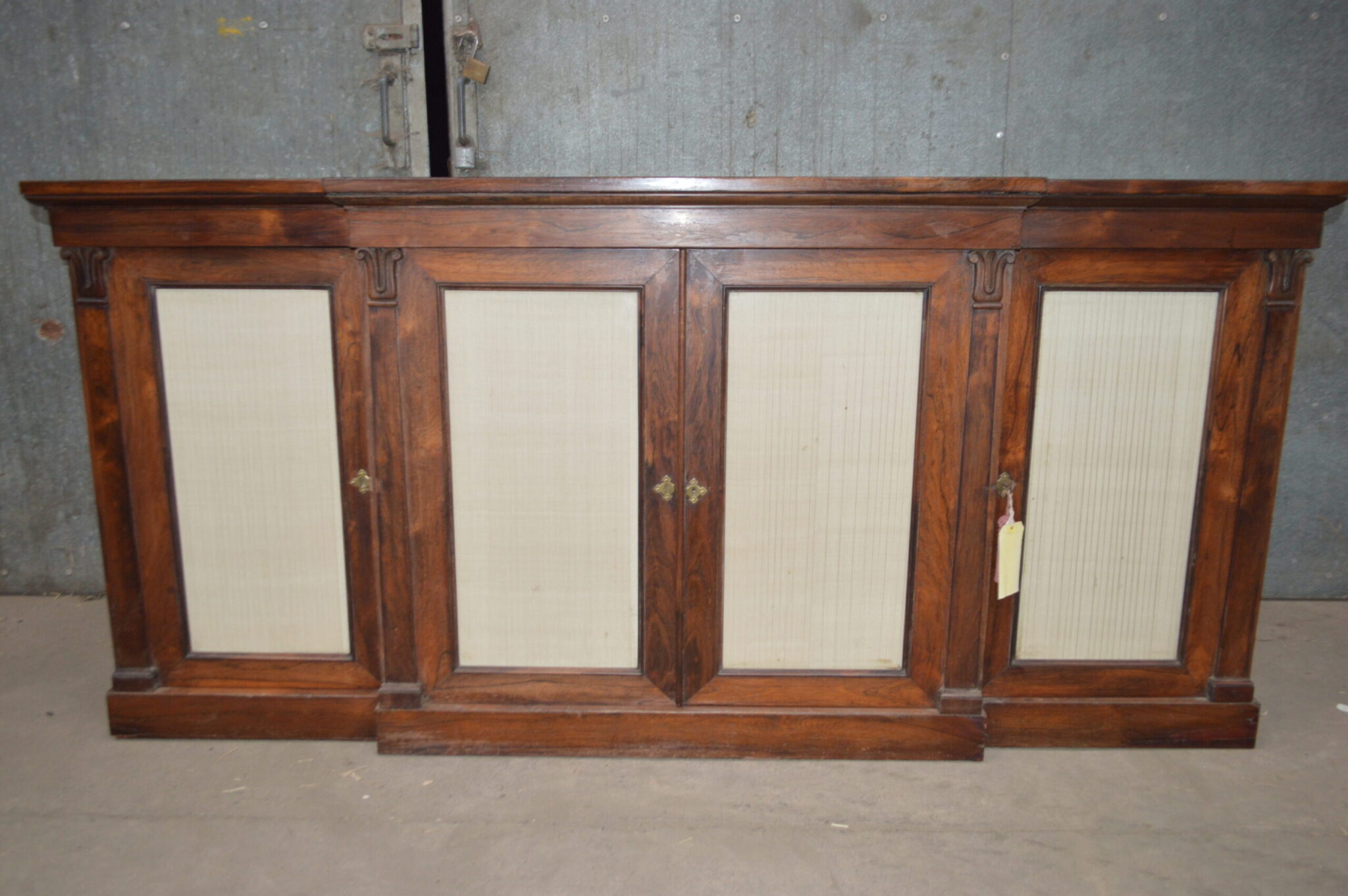 A Regency rosewood four door breakfront sideboard