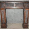 A Carved oak Victorian fire surround.