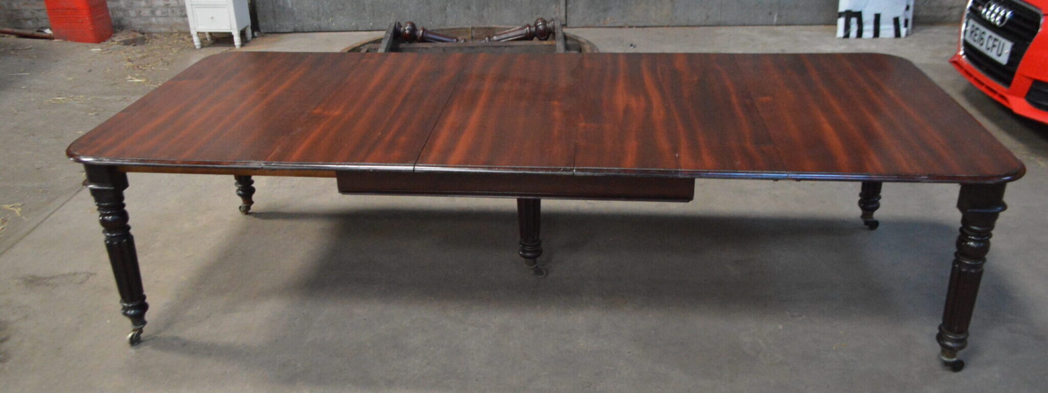 Gillows type pullout extending mahogany dining table, with three leaves.