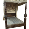 An 18th century style carved oak four poster bed with embroidered drapes, length 211cm, depth 150cm, height 223cm