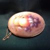 Worcester gold mounted fallen fruits brooch, by Richard Sebright