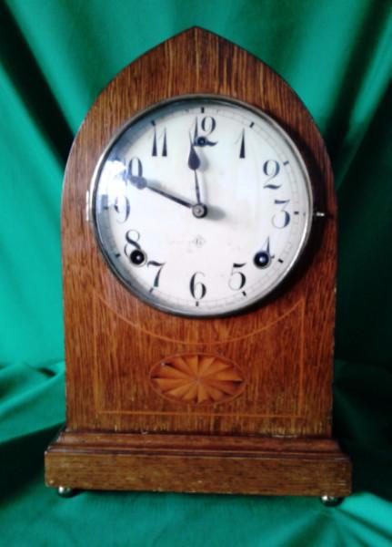 Edwardian oak cased lancet clock