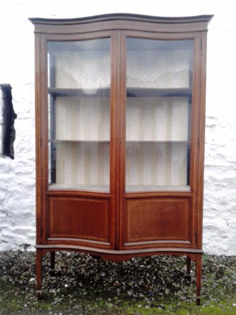 Large Edwardian mahogany serpentine display cabinet