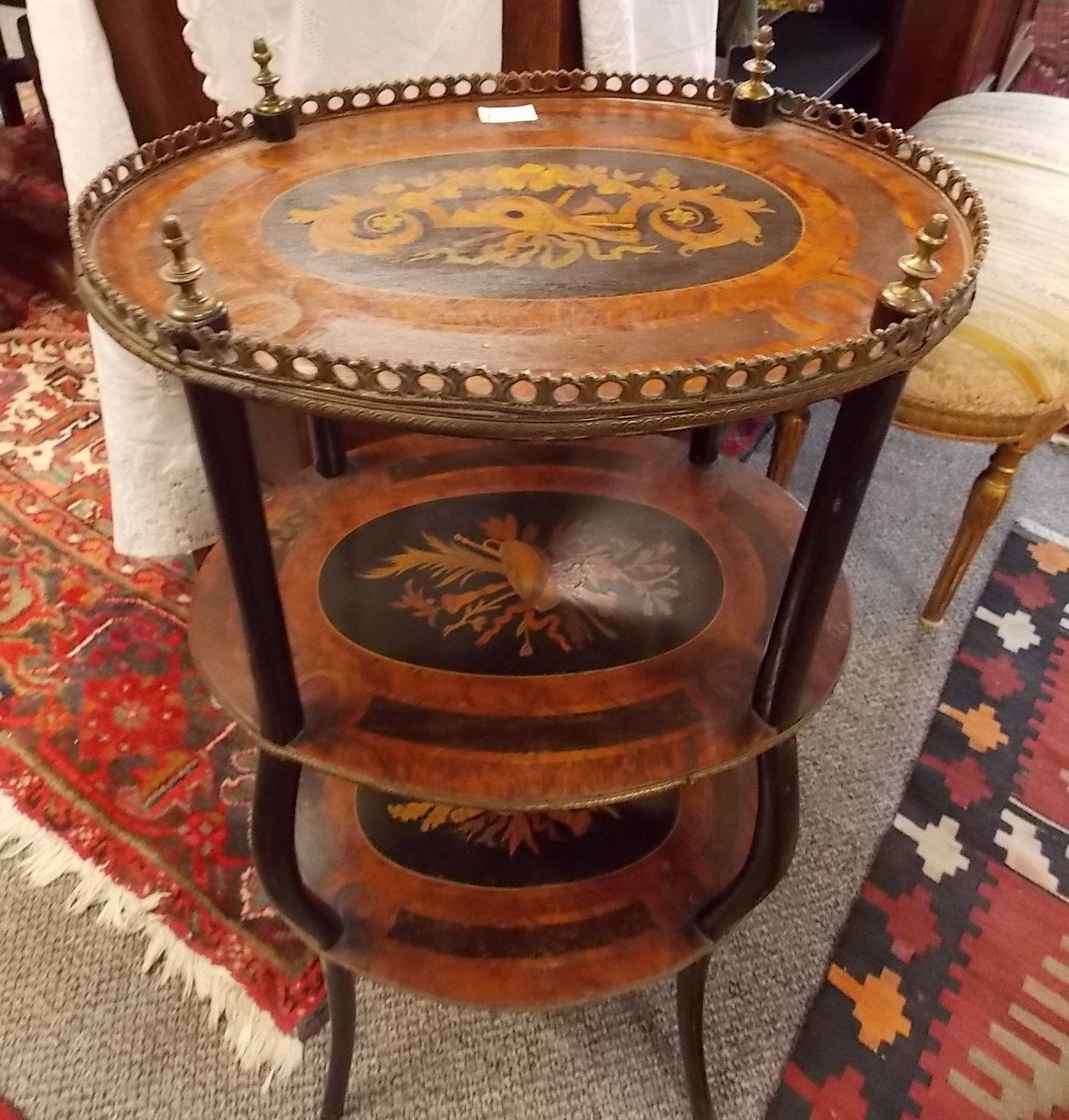 Edwaridan marquetry three tyre occasional table.