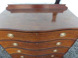Georgian Serpentine mahogany chest of drawers. Antique furniture online.