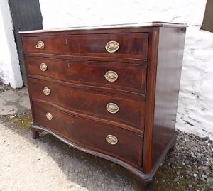 Georgian serpentine mahogany chest of drawers.