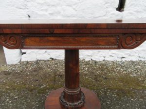 William 1V rosewood fold over card table.