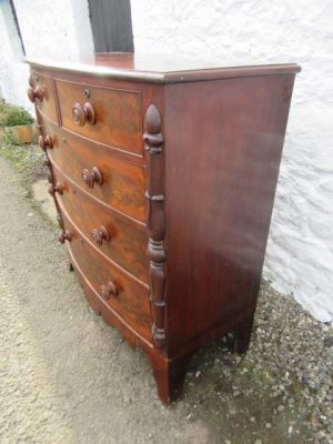 William 1V bowfront figured mahogany chest of two over three drawers