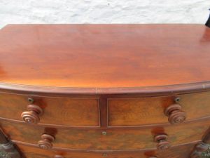 William 1V bowfront figured mahogany chest of two over three drawers