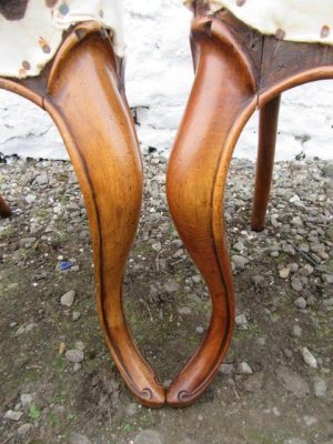 Set of Victorian carved walnut balloon back dining chairs.