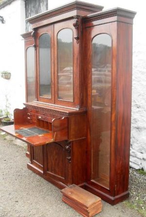 William 1V mahogany breakfront secretaire bookcase.