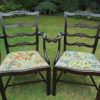 Georgian mahogany carved serpentine fronted ladder back carver chairs.