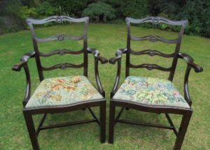 Georgian mahogany carved serpentine fronted ladder back carver chairs.